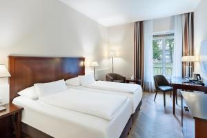 Кровать или кровати в номере Austria Trend Parkhotel Schönbrunn Wien