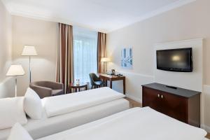 Телевизор и/или развлекательный центр в Austria Trend Parkhotel Schönbrunn Wien