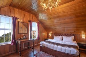 Postel nebo postele na pokoji v ubytování Poshtel, Meghma , Sandakphu