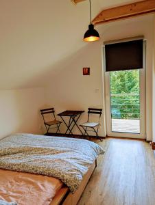 Postel nebo postele na pokoji v ubytování Vila Jedovnice