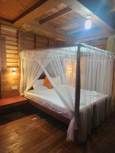 Postel nebo postele na pokoji v ubytování Wilpattu Tree House