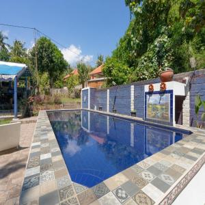 Πισίνα στο ή κοντά στο Calm Haven Villa with Amabela Garden Lovina Beach