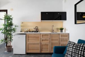a kitchen with a sink and a counter at Playa Marina Ocean View Eco Bungalow in Arrieta +22 photos
