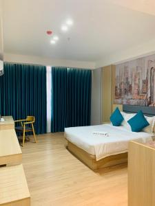 Postel nebo postele na pokoji v ubytování Fan's Hotel Palo