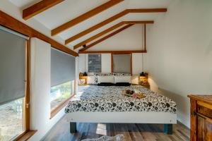 a bedroom with a bed in a room with windows at House with pool, 50 meters from sea, privacy - by TRAVELER tourist agency Krk - ID 2137 in Kornić