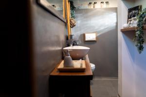 a bathroom with a sink and a toilet at House with pool, 50 meters from sea, privacy - by TRAVELER tourist agency Krk - ID 2137 in Kornić +30 photos