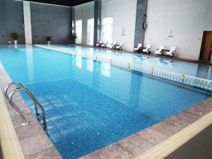Πισίνα στο ή κοντά στο Suqian Canal Jinling Hotel
