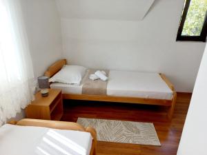 Postel nebo postele na pokoji v ubytování TARA Vila Rajak