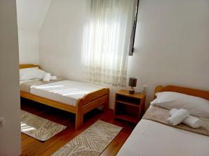 Postel nebo postele na pokoji v ubytování TARA Vila Rajak