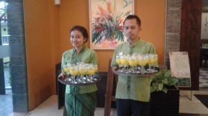 a man and a woman holding glasses of beer at Eclipse Hotel Prawirotaman in Yogyakarta +109 photos