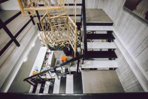 an overhead view of stairs in a building at The Street Hostel Koh Lipe in Ko Lipe