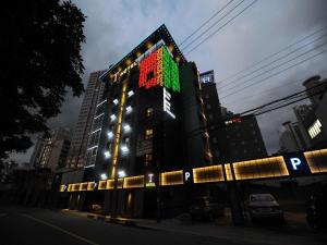 a building with a clock on the side of it at T Hotel in Busan