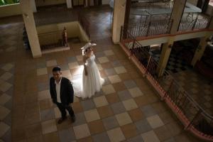 a bride and groom are standing in a building at Arondari Hotel in Sukabumi +138 photos
