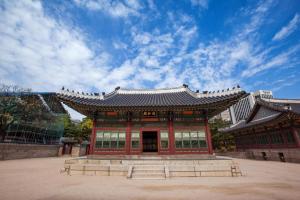 an asian building with a sky in the background at Hotel S Shinchon in Seoul