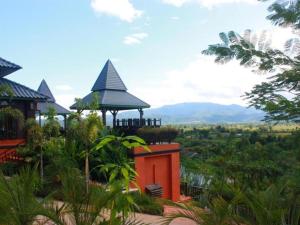 a building with a gazebo with a view at Thaton Hill Resort in Mae Ai