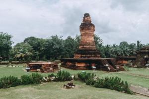 a pagoda in the middle of a park at Grand Hawaii Hotel Pekanbaru in Pekanbaru