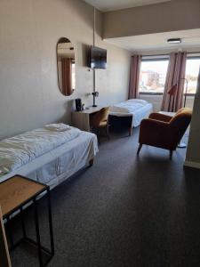 Postel nebo postele na pokoji v ubytování Verdde Hotel Lakselv