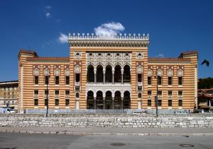 a large brick building on the side of a street at Guest House Edem II in Sarajevo