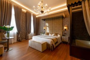 Posteľ alebo postele v izbe v ubytovaní Hotel Canaletto