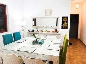 a dining room with a table and some chairs at C J Beach Resort in Colombo