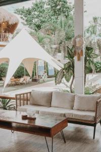 a living room with a couch and a table at Keep Diving Resort Bohol in Panglao