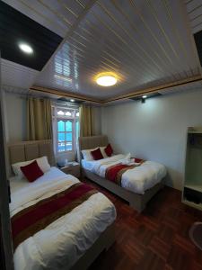 Charikot Downtown Hotel客房内的一张或多张床位