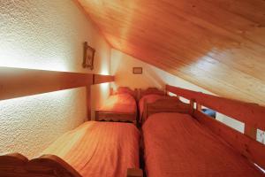 Ένα ή περισσότερα κρεβάτια σε δωμάτιο στο Appartement confortable à Megève - 60 m² - vue sur montagnes
