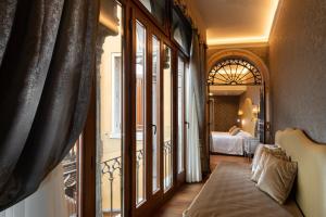 Posteľ alebo postele v izbe v ubytovaní Hotel Canaletto