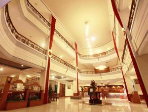 a large building with a staircase in the middle at Plaza Hotel Tegal in Tegal