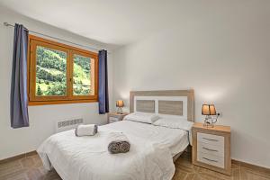 Postel nebo postele na pokoji v ubytování Ski Apartments El Tarter