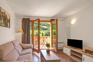 TV a/nebo společenská místnost v ubytování Ski Apartments El Tarter