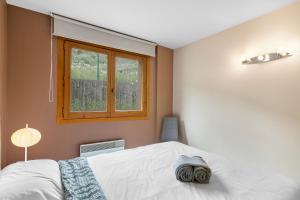Postel nebo postele na pokoji v ubytování Ski Apartments El Tarter