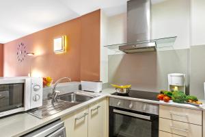 Kuchyň nebo kuchyňský kout v ubytování Ski Apartments El Tarter