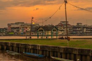 a group of boats in the water near a beach at Star Hotel in Pontianak