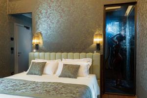 Posteľ alebo postele v izbe v ubytovaní Hotel Canaletto