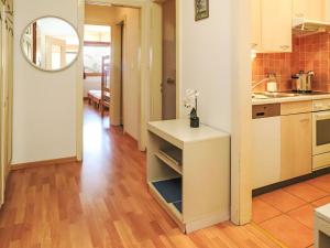 a kitchen with a counter and a table in a room at Apartment Rosablanche A24 by Interhome in Siviez +20 photos