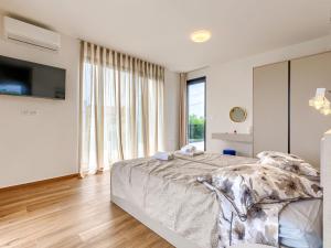 Postel nebo postele na pokoji v ubytování Villa Gorica by Interhome