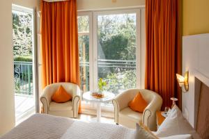 Postel nebo postele na pokoji v ubytování Hotel Garni Inselparadies Zingst
