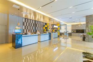 صورة لـ Echarm Hotel Qujing High-speed Railway Station Five Pavilions and One Center Branch في Qujing