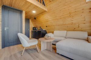 a living room with a couch and a table at Ikalto Woods in Telavi