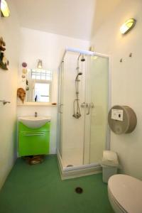 a bathroom with a shower and a toilet and a sink at Thalassa Beach House - Kea Villa Rent - Kastellakia Bay Villas in Pisses