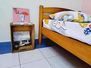 a bedroom with a bed with a mirror next to it at HAPPY HOMESTAY Lukut NS in Port Dickson