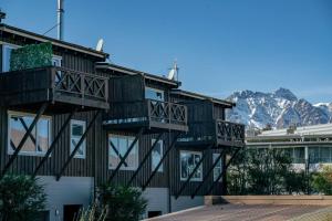 a building with balconies on the side of it at Urban Oasis - Central with Lakeview in Queenstown