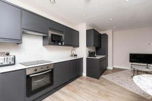 Η κουζίνα ή μικρή κουζίνα στο Modern 1Bed Flat in the Heart of Leeds City Centre