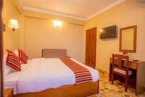 Katil atau katil-katil dalam bilik di Hotel Liberty
