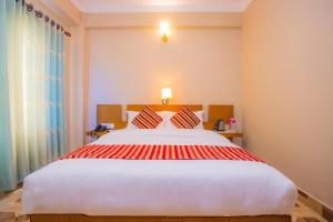 Katil atau katil-katil dalam bilik di Hotel Liberty