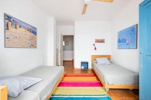 A bed or beds in a room at Casa del Mar Még 37 kép