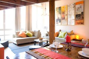 a living room with a couch and a table at Friendly Rentals Monet in Barcelona
