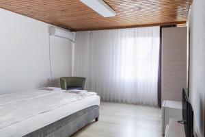 Postel nebo postele na pokoji v ubytování Vila Oska