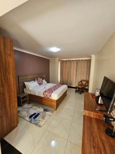 Uma cama ou camas num quarto em Big Tusks Hotel, Marsabit